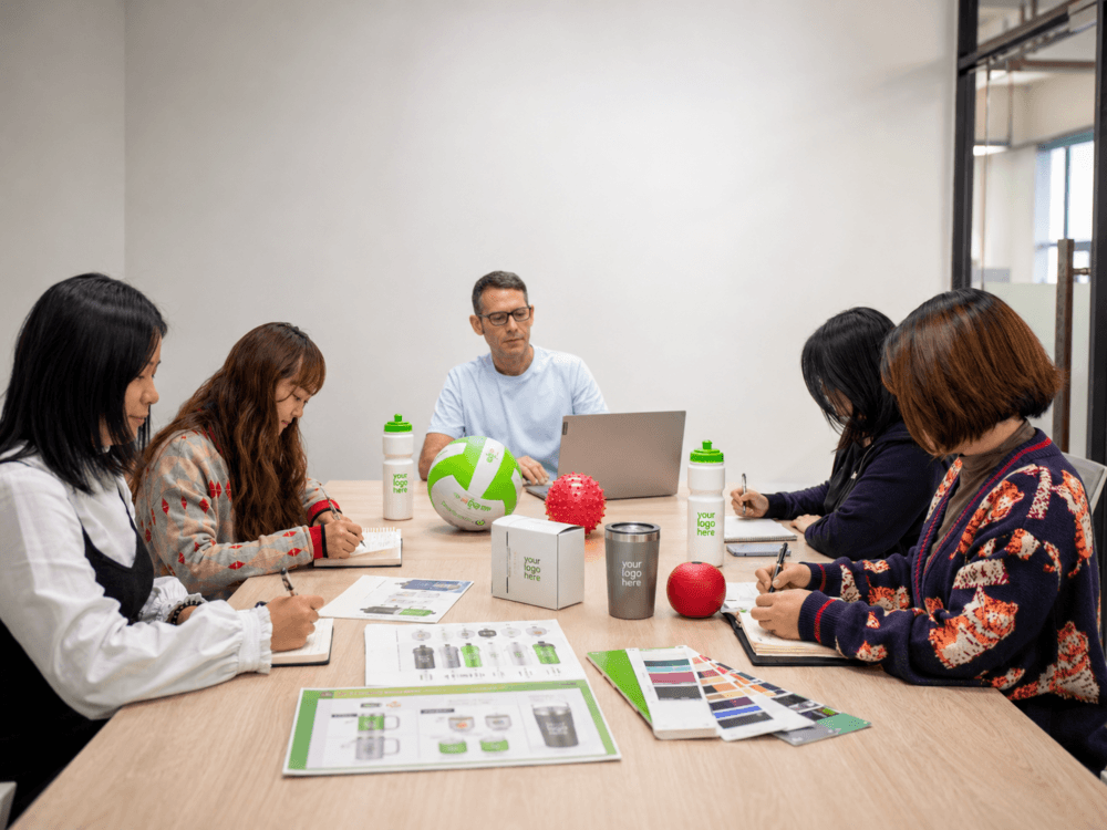 Sphere Resources team reviewing promotional product samples